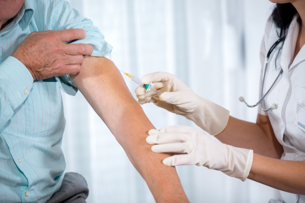 patient receiving a vaccine jab